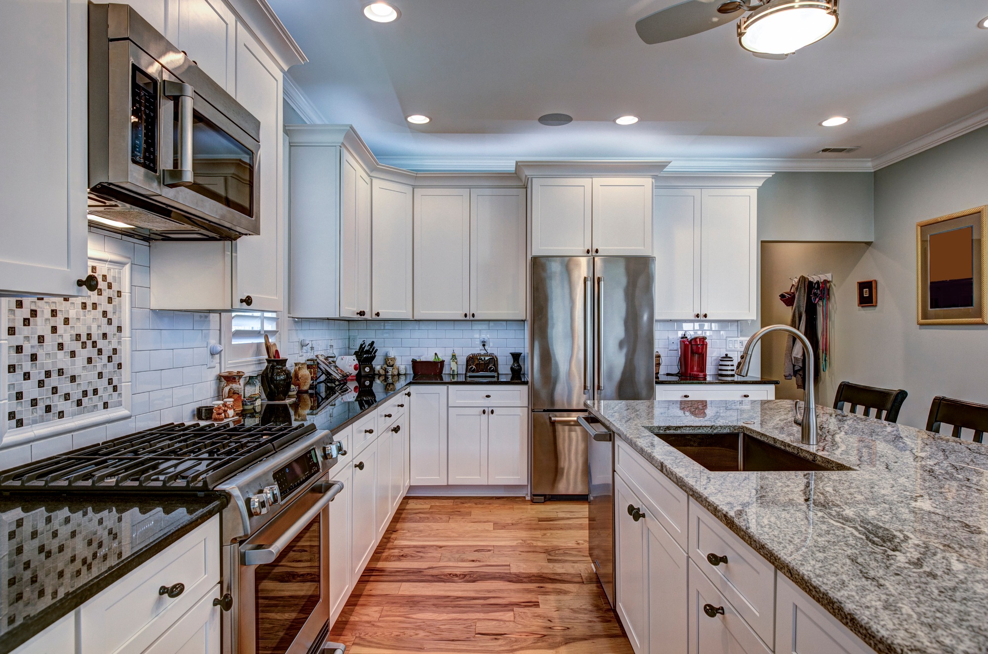 High-end luxury kitchen with granite countertops and white cabin